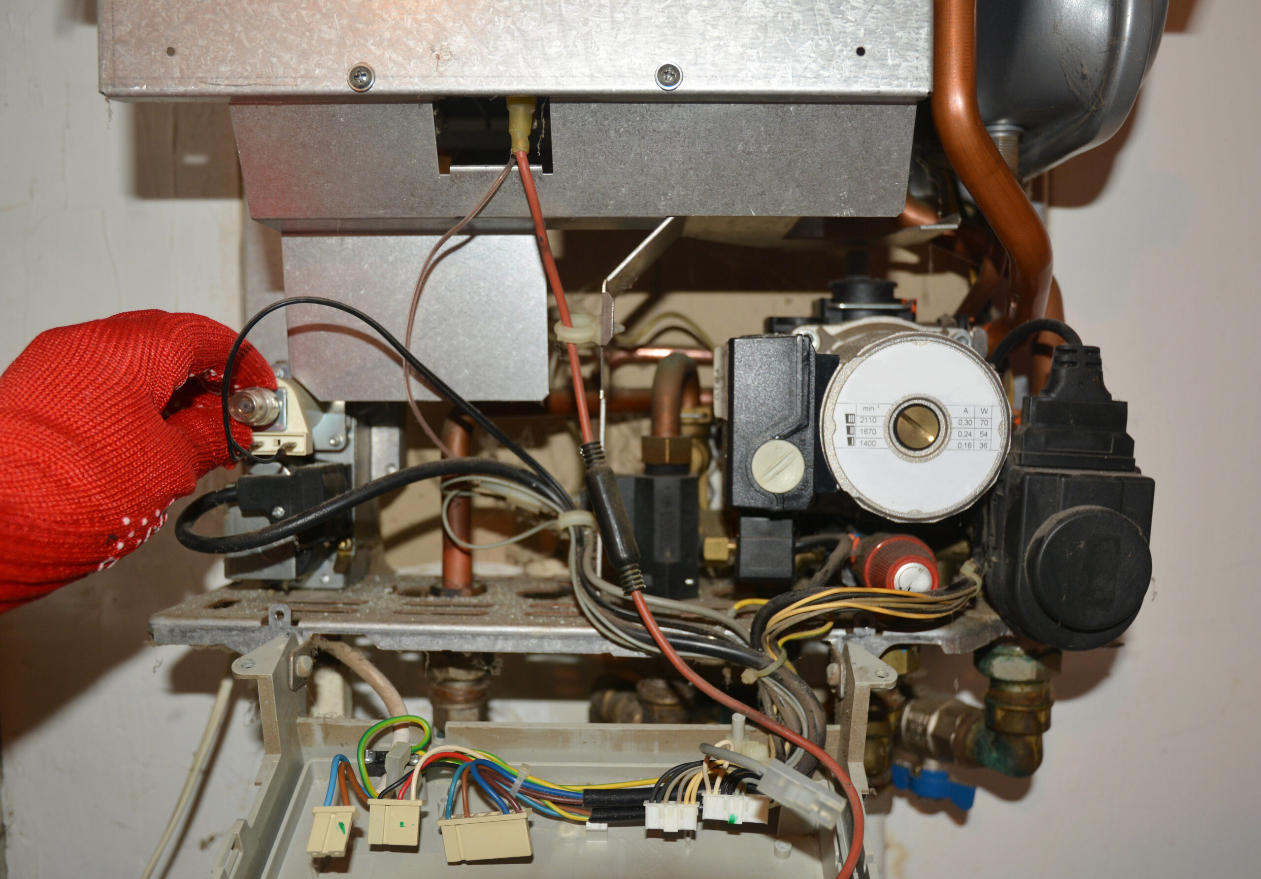 Gas boiler with internal elements exposed for repairs