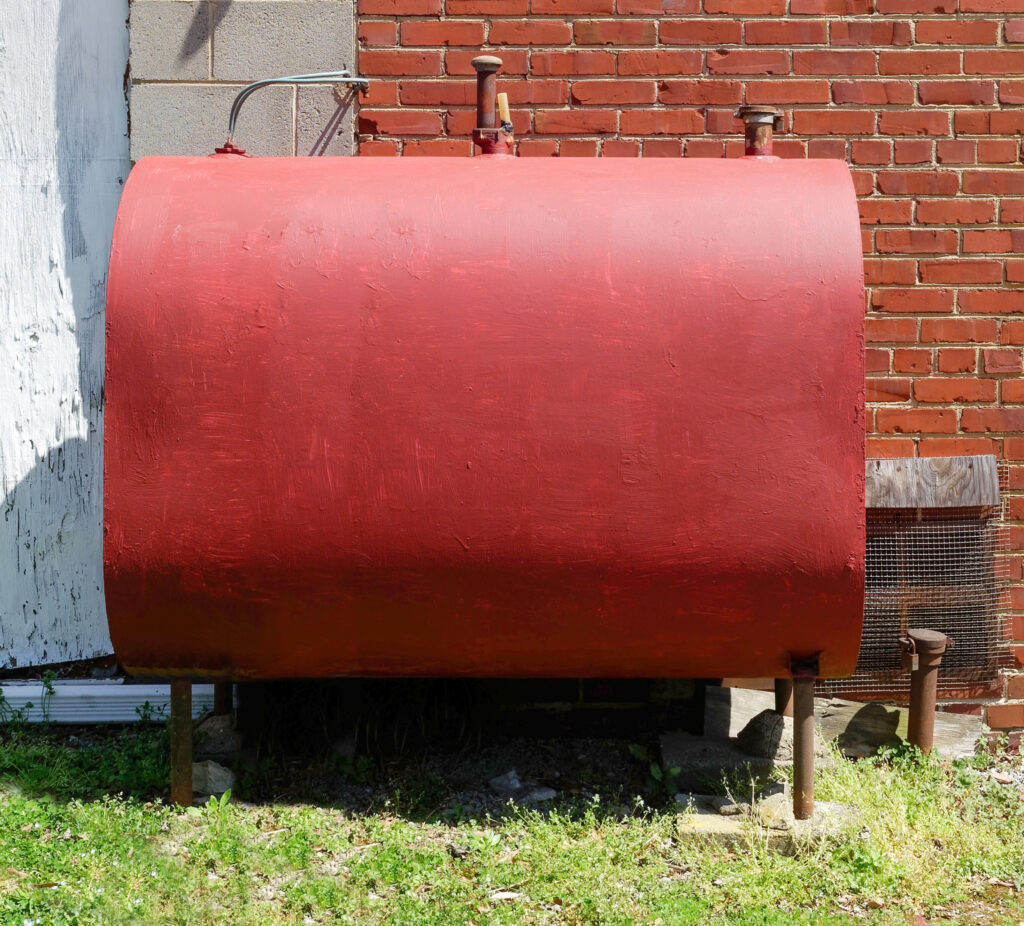 Freshly red painted home heating oil tank